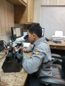 Terra Guidance Geologist performing mudlogging analysis